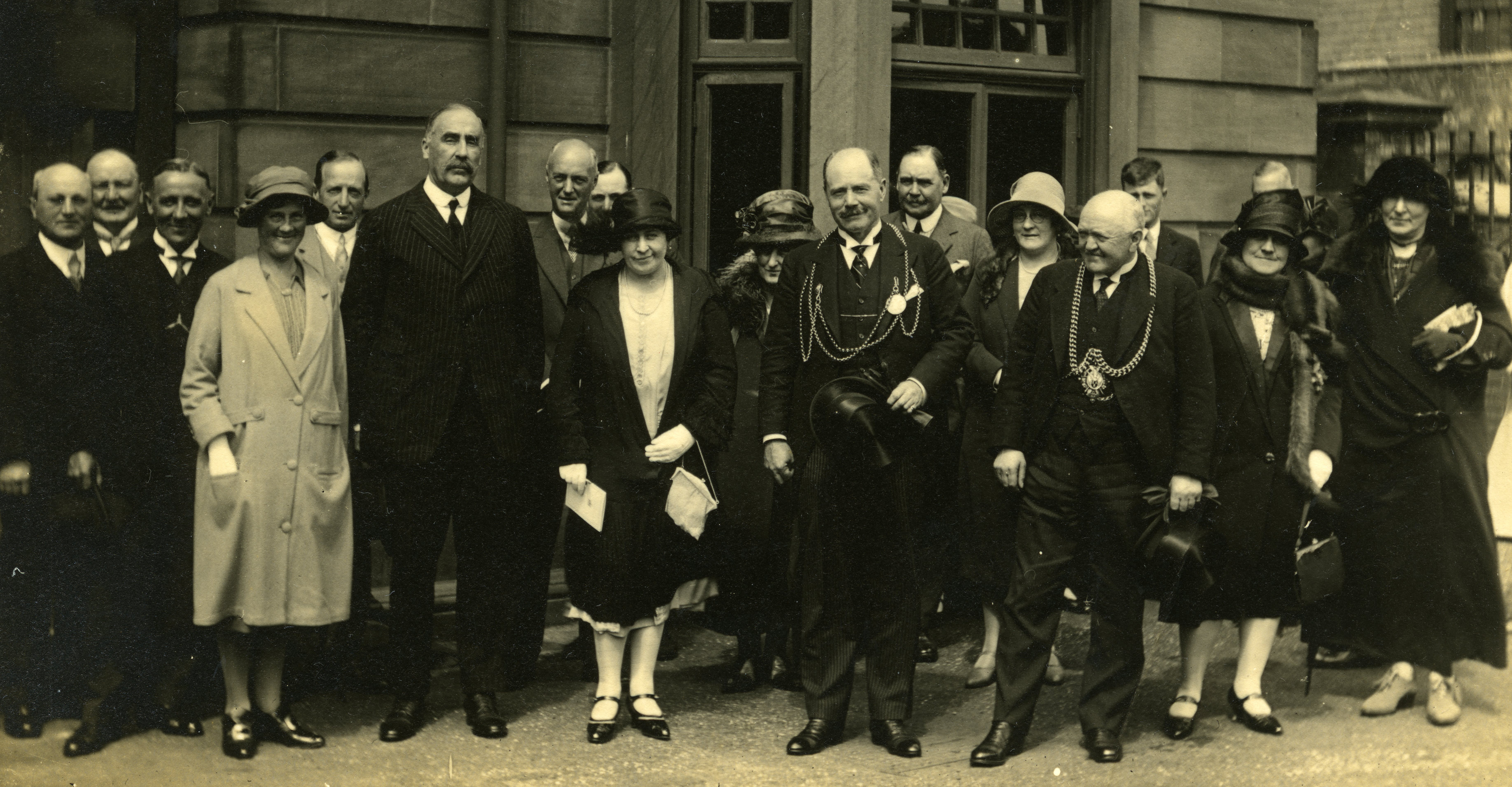 Teresa Merz stands among a group of well dressed people in an old photo from the 1920s