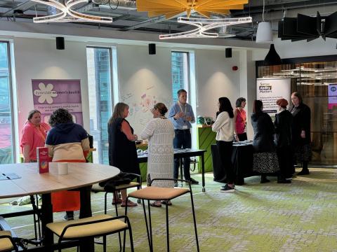 A picture of attendees mixing with charity representatives at the Trustee Broker Event on 4 July 2024