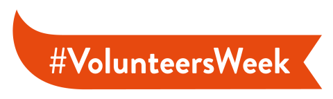 #VolunteersWeek written on an orange banner