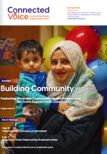 The cover of the magazine shows a smiling women holding a toddler 